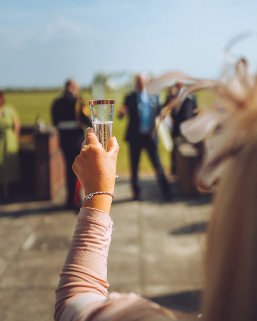 A Wedding day Champagne toast during the Groom's speech.speech