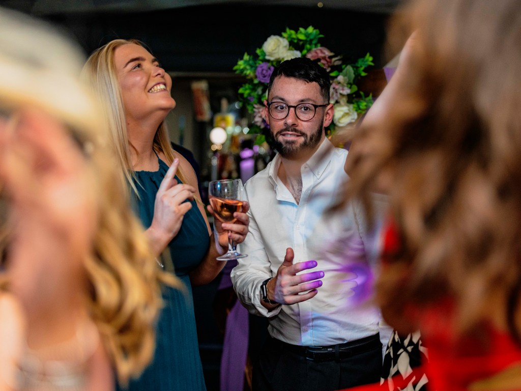 Guests dancing during wedding celebration party